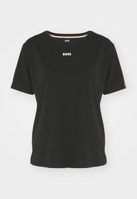 Black short-sleeve t-shirt made of cotton, featuring a round neck and white "BOSS" logo on the chest. Simple design with a relaxed fit.