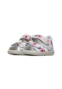 Scarpe bianche di plastica con motivo floreale in rosa e verde, dotate di due cinturini regolabili in Velcro e lati forati per la traspirabilità.