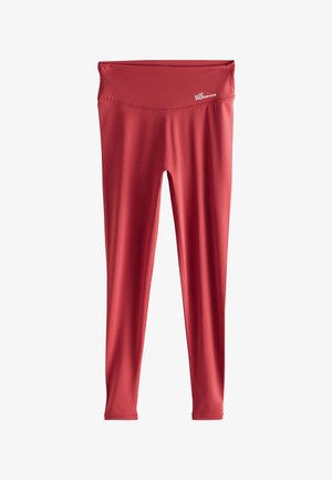 Rote, hochtaillierte, lange Sportleggings mit kleinem weißen „Self Athletics Club“-Logo am Bund.