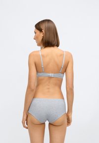 Grey cotton bra and matching brief, both featuring a smooth texture and adjustable straps, with a simple back closure and no visible patterns.