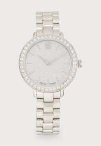 Silver-tone wristwatch with a sparkling silver dial, clear stone accents around the bezel, and a metal link bracelet. Swiss made.