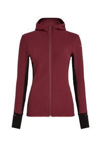 Felpa con zip color marrone bordeaux, realizzata in tessuto testurizzato, con pannelli laterali neri e un colletto alto. Presenta maniche lunghe e fori per il pollice sui polsini.