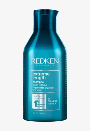 Niebieska butelka szamponu Redken Extreme Length dla włosów podatnych na łamanie z biotyną i formułą o wyważonym pH, pojemność 300 ml.