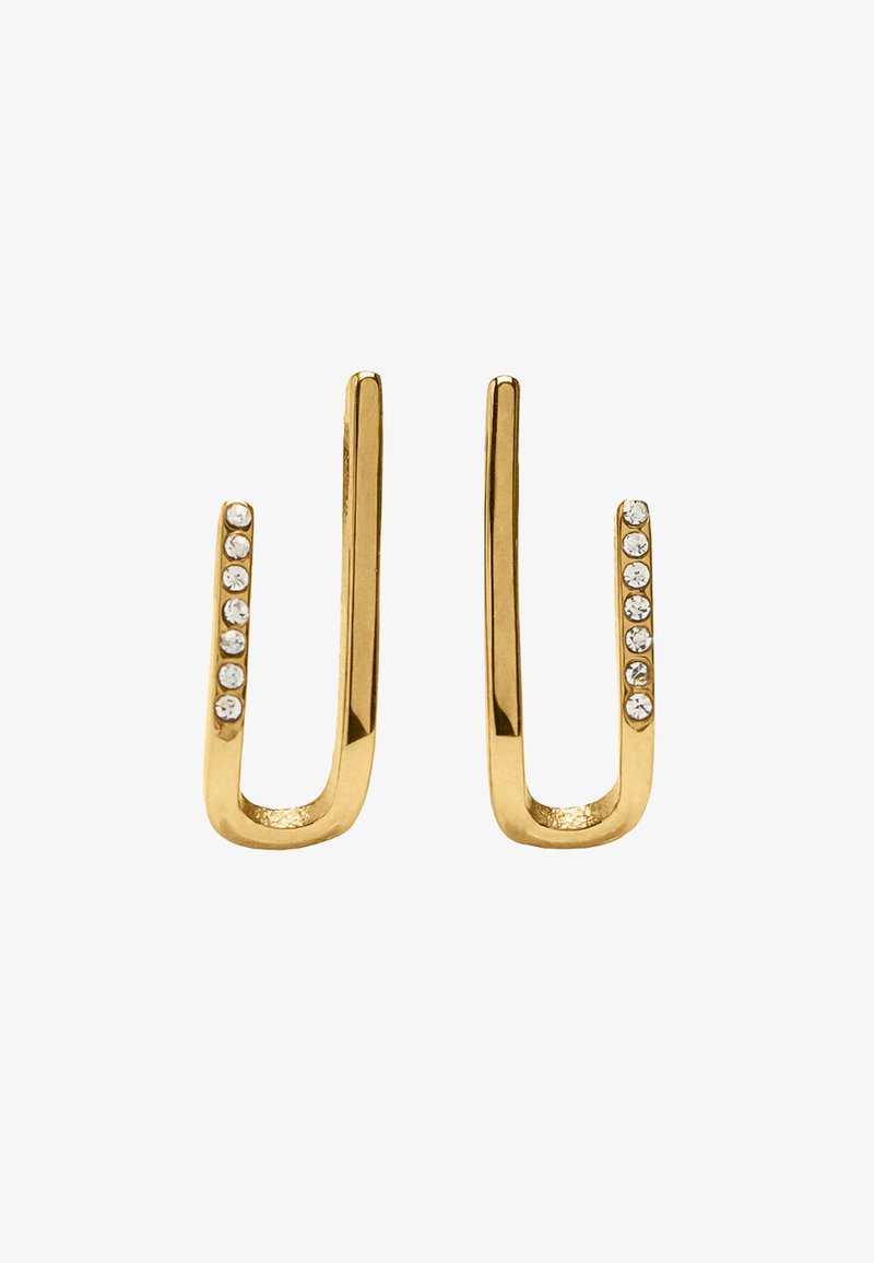 Złote kolczyki o gładkim, wydłużonym kształcie U. Po jednej stronie znajduje się rząd siedmiu małych, przezroczystych kamieni dla dodatkowego detalu. Gładkie, metaliczne wykończenie.