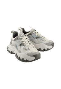 Chunky white and grey sneakers with layered design, textured surfaces, bold black rubber soles, and perforated accents for breathability.