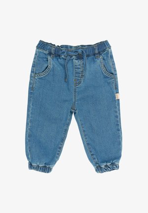 Svetlo modré džínsy majú elastický pás s šnúrkou na utiahnutie, dve bočné vrecká a elastické manžety na členkoch.