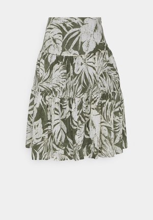 Jupe mi-longue à volants avec un motif de feuilles tropicales vertes et blanches et des coutures froncées.