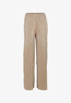 Beżowe, szerokie spodnie wykonane z materiału z żebrowanym welurem. Posiadają elastyczny pasek w talii dla komfortu oraz gładką, miękką teksturę.