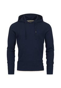 Sudadera azul marina hecha de tejido texturizado con un patrón acanalado, cordones ajustables y un forro de contraste alrededor de la capucha.