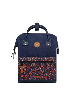 Navy corduroy backpack with floral fabric pocket, leather accents, top handle, zippered front pocket, and logo detail.