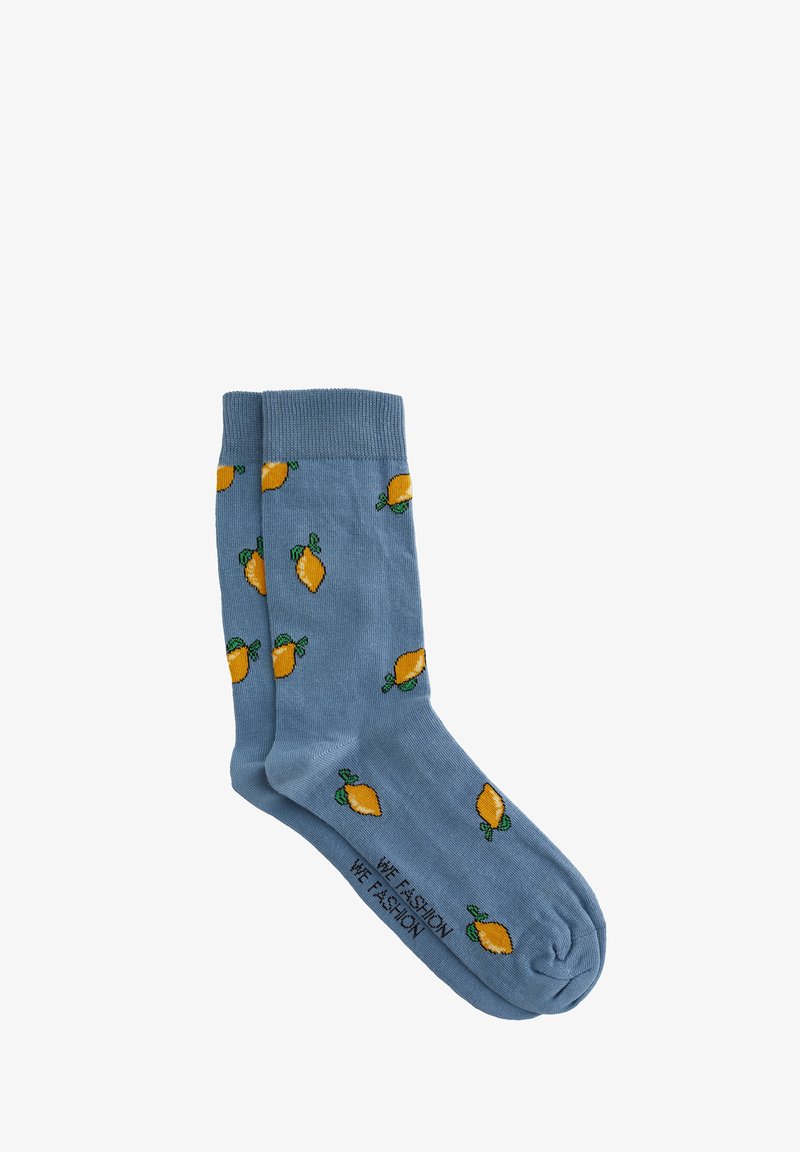 Calzini blu con motivi a limone gialli, tessuto strutturato, polsini a coste e testo a contrasto: "NOI MODA NOI MODA" sul lato.