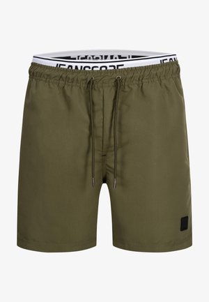 Olijfgroene zwembroek met een elastische tailleband, verstelbaar trekkoord en een klein zwart logo op de voorkant links. Glad stoftextuur.