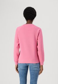 Lacoste Sportska majica - reseda pink