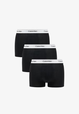 Boxer briefs pretos com um elástico da Calvin Klein em branco. Tecido suave, ajuste regular, embalados em três unidades.