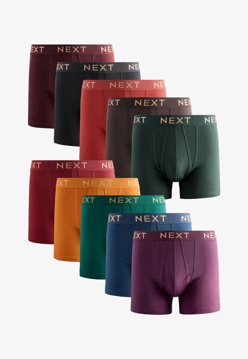 Nove paia di boxer da uomo in vari colori tinta unita, ognuno con una fascia elastica in vita con la scritta "NEXT" in lettere a contrasto.