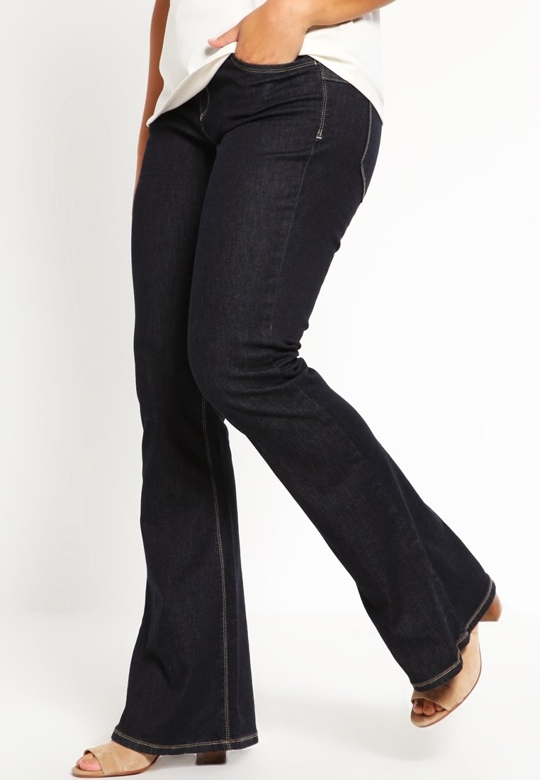 Mörkblå utsvängda jeans i denim, med femficksdesign, kontrasterande sömmar, medelhög midja och diskret stretch för komfort.