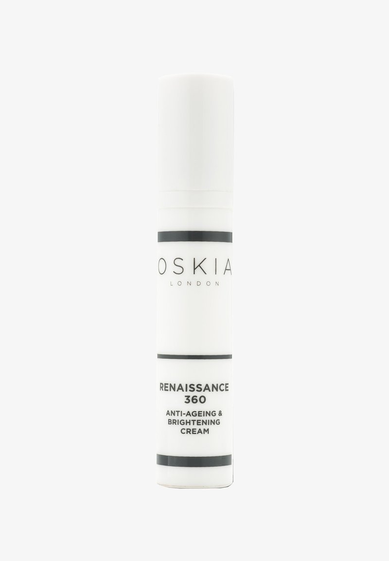 Flacon cylindrique blanc de crème anti-âge et éclaircissante Oskia Renaissance 360 avec texte noir et bandes sur fond blanc.