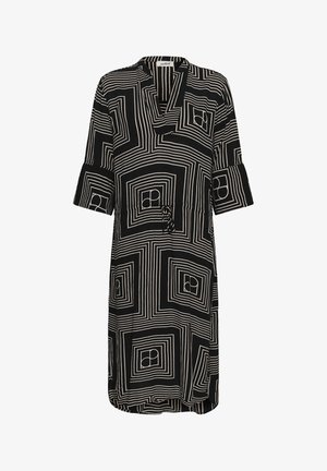 Black knee-length dress with white geometric square patterns, V-neck, three-quarter sleeves, and a waist tie.