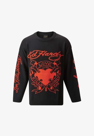 Black knitted sweater featuring bold red graphic designs, including the words "Love Kills Slowly" and a heart motif. Crew neck and long sleeves.