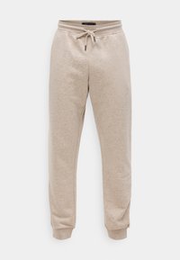 Pantaloni de trening bej, realizați dintr-un material moale din amestec de bumbac. Prezintă o talie elastică cu șnur și mansete ajustate la glezne.
