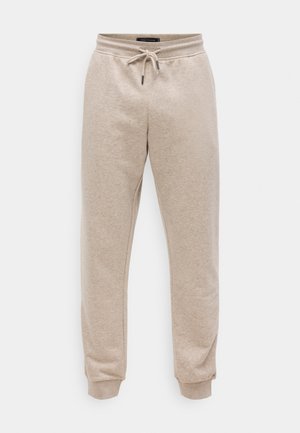 Šviesiai rudos spalvos sportiniai kelnių, pagaminti iš minkštos medvilnės mišinio. Su elastinga juosmens juosta su raišteliu ir siaurėjančiomis rankovėmis ties kulkšnimis.