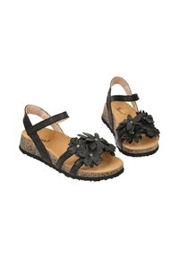 Černé květinové sandály se širokými pásky, korkovou podešví na klínu a texturovanou gumovou podrážkou. Obsahují květinové dekorace s ozdobnými hroty.