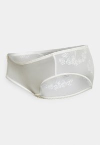 Slips in pizzo bianco con ricami floreali, pannelli in rete trasparente e bordi ondulati. Tessuto morbido, design moderno e vestibilità a copertura totale.