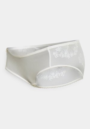 White lace panties with floral embroidery, sheer mesh panels, and scalloped edges. Soft fabric, modern design, and full-coverage fit.