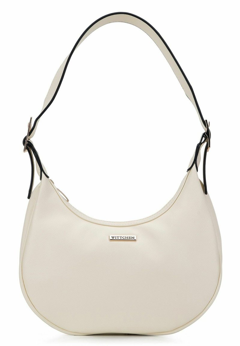 Krämfärgad halvmånehandväska med en justerbar axelrem i svart och en liten metallplatta med "WITTCHEN"-logotyp i fronten.