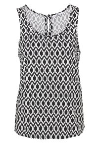 Haut sans manches noir et blanc à motif ikat, avec un col rond et un détail dos à ouverture en trou de serrure. Tissu doux avec une texture lisse.