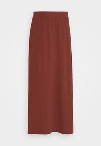 Jupe longue de couleur rouille, fabriquée en tissu doux et extensible. Elle possède une taille élastique et un design simple et fluide sans motifs ni accents.