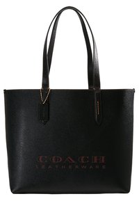 Czarna skórzana torba na ramię o fakturowanym wykończeniu, z podwójnymi uchwytami i wytłoczonym logo "COACH LEATHERWARE" w kontrastującym brązowym kolorze.