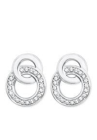 Orecchini in metallo argentato con design circolari intrecciati. Un anello è decorato con una fila di cristalli trasparenti lungo il bordo.