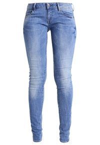 Vaqueros pitillo de mezclilla azul con acabado desgastado, cinco bolsillos y cierre de cremallera. Tejido de mezcla de algodón con una textura suave.