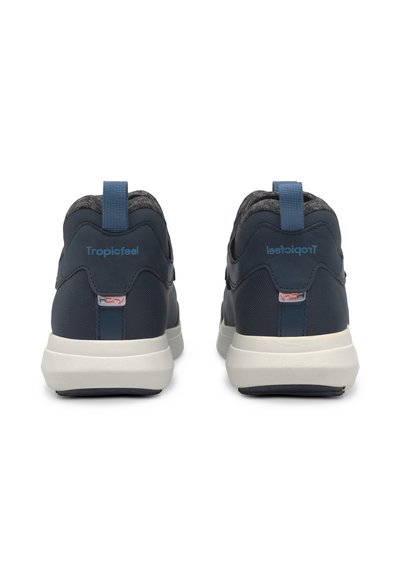 Navy athletic shoes with a textured fabric upper, a padded collar, and a blue pull tab. Features a light-colored sole with branding on the heel.