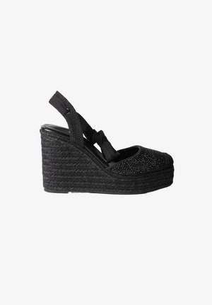 Fekete sarokbetétes espadrille szandál fonott talppal, bokapánttal masnival és texturált lábujjrészlettel.