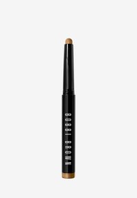 Bobbi Brown Concealer-Stift in einem schwarzen Rohr mit goldenem Fu�ß. Die Spitze ist rund und cremig-weiß, entworfen für eine präzise Anwendung.