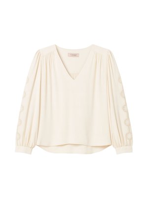 Blusa crema con scollo a V, davanti plissettato e maniche a sbuffo con ricami floreali lungo i polsini e una vestibilità morbida all'orlo.