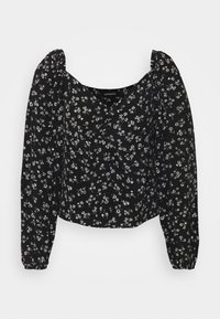 Blusa nera floreale con maniche lunghe a palloncino; presenta un collo quadrato e modelli di fiori bianchi sparsi su un tessuto morbido.