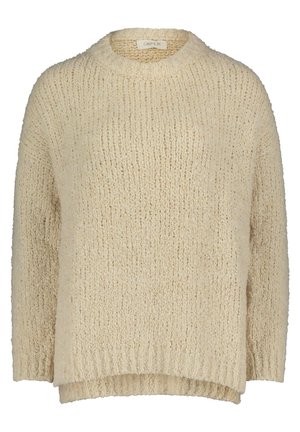 Beige knitted sweater with a round neckline, dropped shoulders, and ribbed hems. Texture is soft and chunky with a loose, relaxed fit.