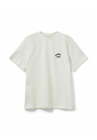 Vaalean kermanvärinen lyhythihainen t-paita puuvillaa, pyöreällä kaula-aukolla, jossa on musta huulipainatus rinnassa, sileä texture ja rento istuvuus.