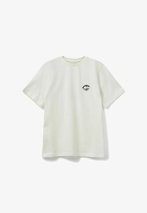 T-shirt à manches courtes en coton couleur crème clair avec un col rond, présentant un imprimé de lèvres noires sur la poitrine, texture lisse et coupe décontractée.