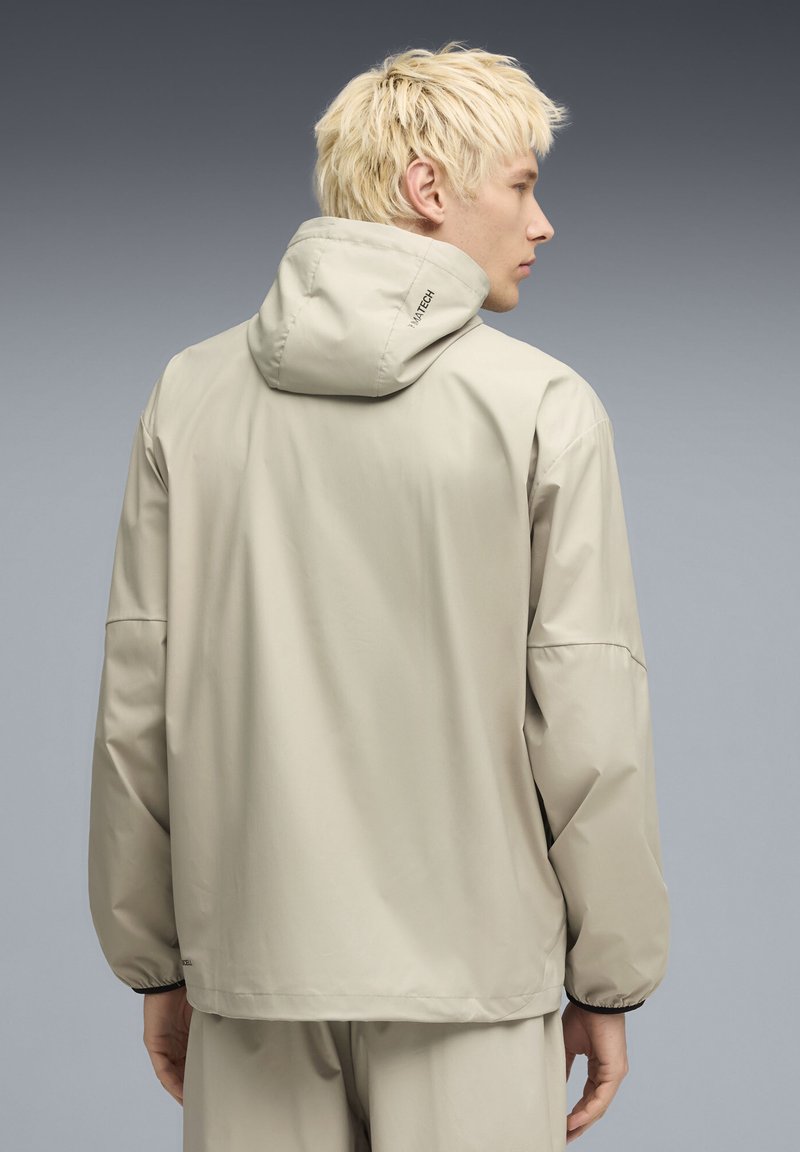 Veste Imperméable Pebble Beach Homme – Beige Taille L – Demi-fermeture