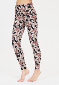 Leggings floraux avec un schéma de couleurs noir, crème et bordeaux, dotés d'une coupe ajustée et d'un tissu lisse et extensible.