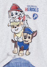 Gray fabric with a graphic of three cartoon dogs: a firefighter dog, a yellow dog, and a police dog, labeled "WE ARE ALL HEROES."