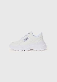 White sneakers made of textured synthetic material with a thick, rugged sole. Features include laces, a padded collar, and a logo detail.