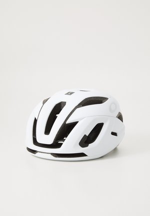 Casque de vélo blanc avec intérieur noir, design aérodynamique, plusieurs trous de ventilation et sangles réglables pour un ajustement sécurisé.