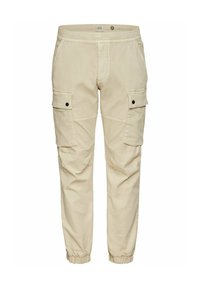 Pantalon cargo beige avec taille et poignets élastiques, deux poches avant à rabat avec boutons-pression, et poches latérales fendues.