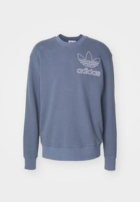 Modrá bavlněná mikina s dlouhými rukávy, kulatým výstřihem a vyšitým logem Adidas na hrudi. Hladká textura s žebrovanými manžetami.