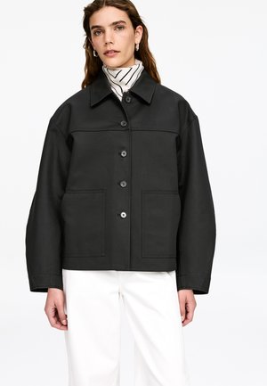 Black jacket with a collared neckline, front pockets, and button closure. Features a structured design and a smooth, textured fabric.